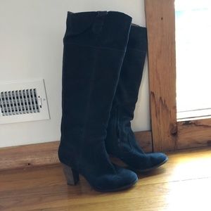Black knee-high leather boots by Dolce Vita